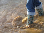 SX11255 Jenni in boots walking through icy puddle.jpg